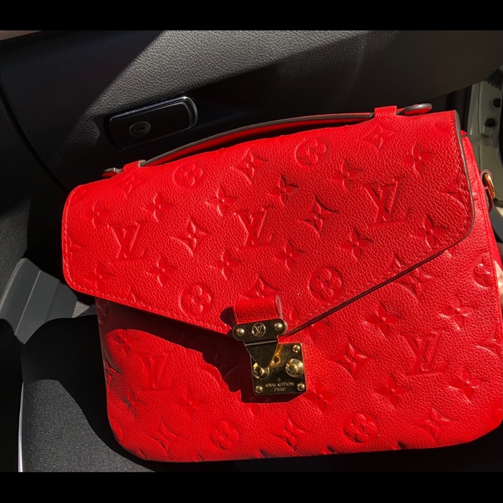 Authentic Louis Vuitton red pochette metis